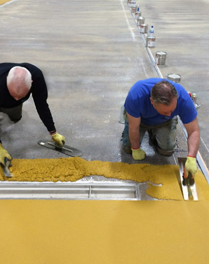 Two men applying FasTop Multi Systems by Sherwin Williams